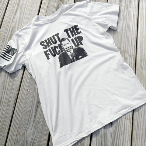 The American Lictor Collab Tee: Grimzy-STFU features a black graphic and SHUT THE FUCK UP on white, plus a stylized flag on the sleeve. Made from compacted ring-spun cotton. See our size guide for your perfect fit.