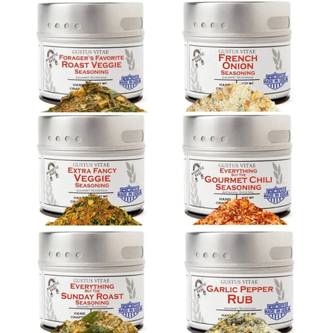 The Gustus Vitae Slow Cooker Seasonings - 6 Spice Blends Gift Set displays six tins: Forager’s Favorite Roast Veggie, French Onion, Extra Fancy Veggie, Gourmet Chili, Sunday Roast, and Garlic Pepper Rub—ideal for instant pot or slow cooker recipes.