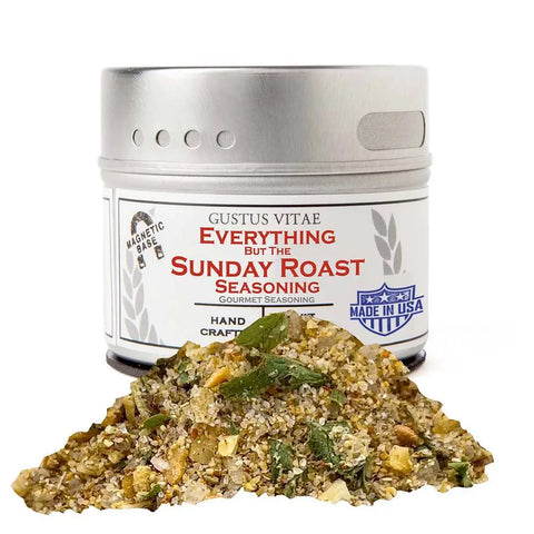 A tin labeled Gustus Vitae Taste of Home – For Your Instant Pot (4 Pack) sits behind a mound of coarse, mixed gourmet spice blends with visible herbs and spices, featuring a Made in USA logo and a magnetic base label.