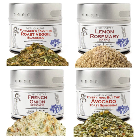 The Gustus Vitae Chefs Secret Luxury Seasonings & Sea Salts Pack includes four tins—Foragers Favorite Roast Veggie, Lemon Rosemary, French Onion, and Avocado Toast—with a sample of each distinctive blend displayed in front.