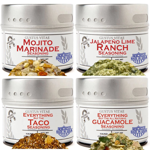 The Gustus Vitae Everything but the Taco Night Collection features four open tins—Mojito Marinade, Jalapeno Lime Ranch, Everything But the Taco, and Everything But the Guacamole—showcasing gourmet, all-natural non-GMO spice blends.