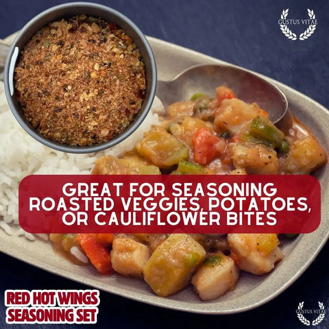 A close-up of rice, seasoned roasted vegetables, and sauced potatoes sits beside our Gustus Vitae Red Hot Wing Spice Set—premium gourmet blends made in the USA—perfect for roasted veggies, potatoes, or cauliflower bites.