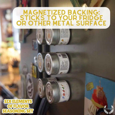 Six Gustus Vitae spice tins with clear labels are magnetically attached to a fridge in a kitchen. Text highlights the magnetic backing and gourmet blends in the Gustus Vitae Six Flavor Seasoning Set – Gourmet Spice Collection, made in the USA.