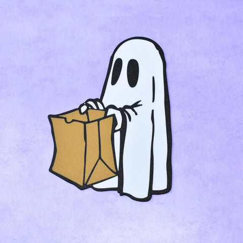 A cartoon ghost with big black eyes and a brown paper bag stands on a light purple background—a fun pick from Chatelet Manufacturing’s Halloween Decorative Fridge Magnets, perfect for Halloween party decorations. Made in USA.