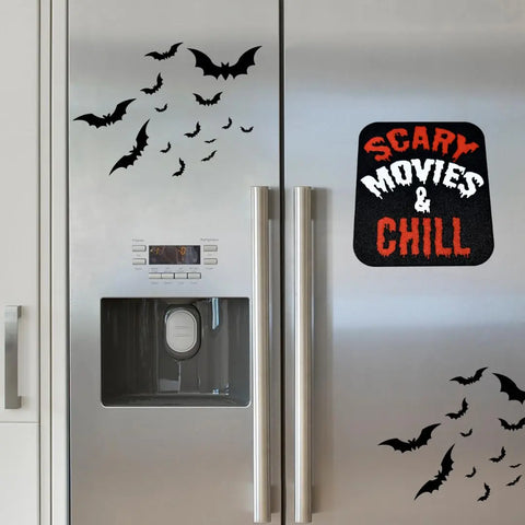 A silver fridge displays Chatelet Manufacturings Halloween Decorative Fridge Magnets—perfect for spooky parties—and a “Scary Movies & Chill” sign in red and white; the left door features a handy water dispenser. Made in USA.