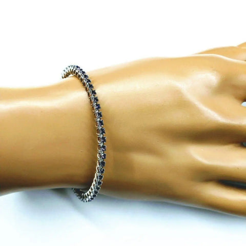 The Alexa Martha Designs Wire Wrapped Amethyst Crystal Tennis Bracelet Bangle is shown on a mannequin hand against a white background, featured alongside other handmade crystal jewelry.