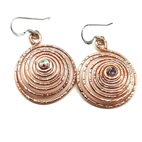Alexa Martha Designs Crystal Embedded Copper Spiral Hoop Earrings feature handmade spirals with fishhook wires and a shimmering crystal at the center for a unique, eye-catching look.