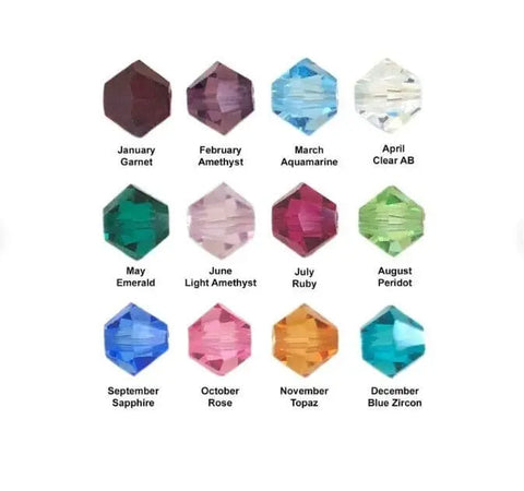 Alexa Martha Designs’ Wire Wrapped Copper Crystal Birthstone Bling Ring features a Swarovski crystal for each month—January Garnet (red), February Amethyst (purple), March Aquamarine (blue), through December Blue Zircon (blue).
