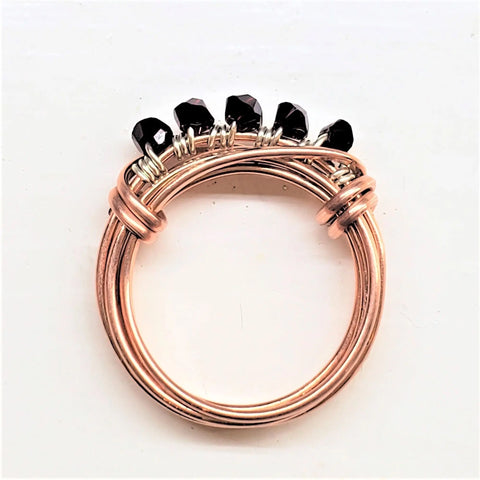 The Alexa Martha Designs Wire Wrapped Copper Crystal Birthstone Bling Ring features multiple bands and five faceted black beads wrapped with silver wire, showcased on a white background.
