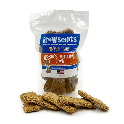 A bag of Brewscuits Rosies Autumn Brew dog treats stands upright with bone-shaped treats in front. The clear package and blue-orange labels highlight natural ingredients that support digestive health, including pumpkin, cranberry, and cinnamon.