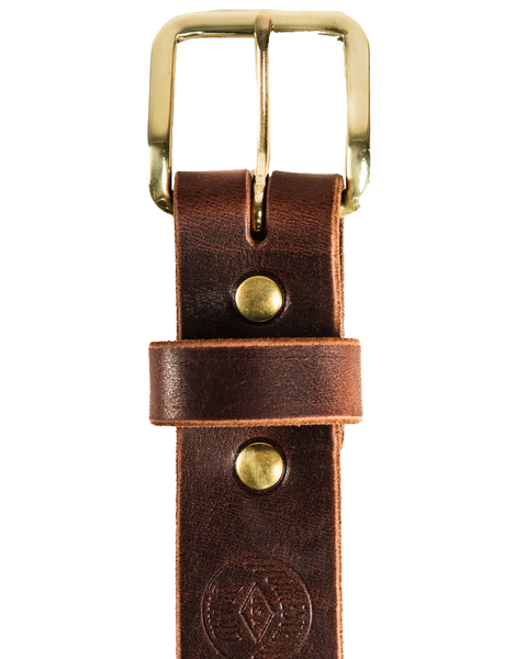A close-up of the Homestead Brand Essential Leather Belt No. 1508, featuring a solid brass buckle and round rivets, crafted from quality brown leather and displayed against a white background.