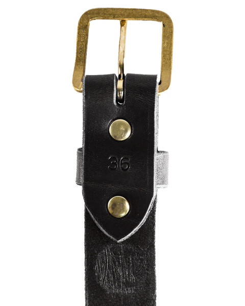 A close-up of the Homestead Brand Essential Leather Belt No. 1508, made in the U.S.A., shows black leather with a solid brass buckle, two matching brass rivets, and size 36 stamped near the buckle.