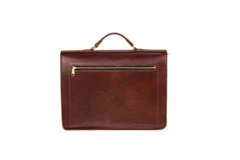 The Urban Southern Executive Briefcase is crafted from brown full-grain leather with a top handle and a gold zipper front pocket, shown against a white background.