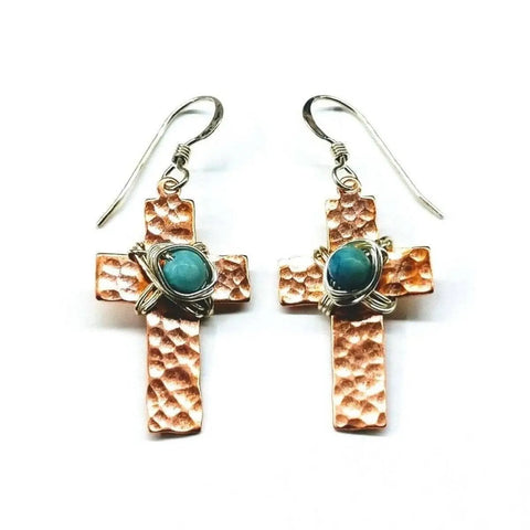 Alexa Martha Designs Hammered Copper Cross Earrings feature turquoise beads in wire wrapping at the center and silver hooks for easy wear.