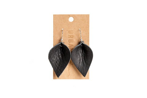 Urban Southerns Everyday Earrings are black, leaf-shaped leather earrings with bronze-plated hooks, displayed on a brown cardboard backing with a hanging hole. Lightweight and perfect for daily wear.