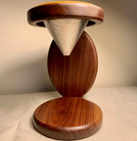 The Handcrafted Reclaimed Wood Coffee Pour Over by Shop Cat Woodworks features a smooth wooden stand with a reusable metal mesh filter. This eco-friendly rustic drip brewer is made in the USA and perfect for artisanal coffee lovers.