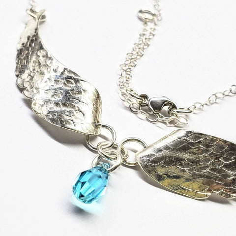 Handcrafted Silver Angel Wing Necklace With Blue Crystal Drop – Montana Forge | Made in USA Alexa Martha Designs  Necklace