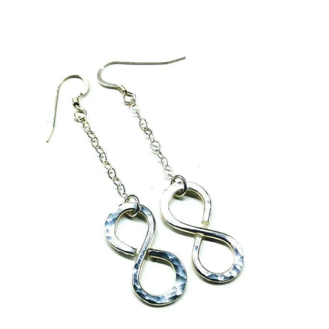 Alexa Martha Designs Sterling Silver Hammer Patterned Infinity Earrings showcase handcrafted infinity symbols on short chain links, displayed against a white background.