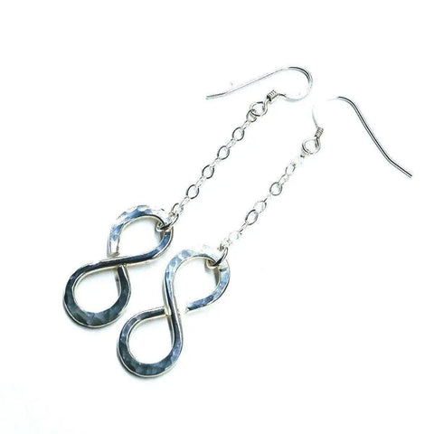 Sterling Silver Hammer Patterned Infinity Earrings by Alexa Martha Designs feature handcrafted infinity symbols on short chains with fishhook ear wires, displayed against a white background.