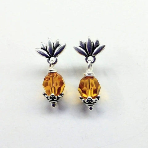 Sterling Silver Crystal Pineapple Studded Earrings by Alexa Martha Designs, featuring sparkling crystal accents in a chic pineapple design, are displayed on a white background.