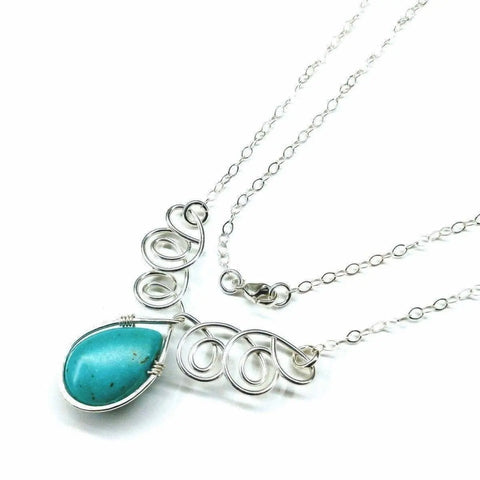 The Alexa Martha Designs As Seen on TV Turquoise Drop Sterling Silver Wire Wrapped Necklace features an intricate swirl design and a teardrop turquoise pendant, displayed on a white background.