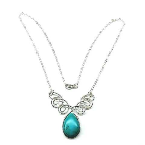 The As Seen on TV Turquoise Drop Sterling Silver Wire Wrapped Necklace by Alexa Martha Designs features an ornate design with a large turquoise teardrop pendant, beautifully handmade and displayed on a white background.