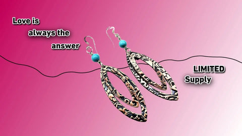 A pair of Turquoise Copper Embossed Pointed Oval Earrings by Alexa Martha Designs displayed on a pink gradient. Text: Love is always the answer and LIMITED Supply in bold, white letters.