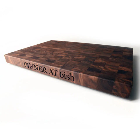 Sourced and manufactured in America, this solid walnut end-grain cutting board can be personalized for any gift or occasion. 