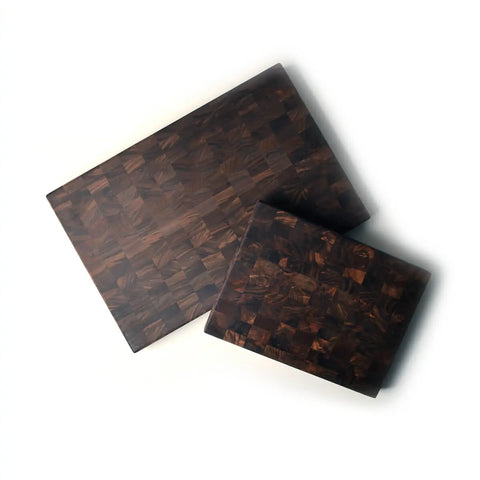 Two Handcrafted Wooden Cutting Boards by Words with Boards—Solid Walnut End Grain, made in the USA—are arranged on a white background, with the smaller board overlapping the larger; ideal for chefs and home cooks alike.