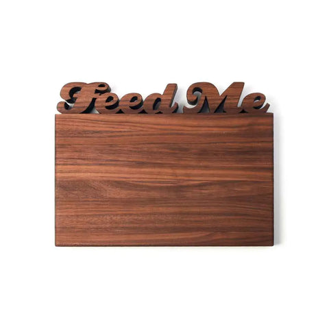 The Words with Boards Handcrafted Wooden Personalized Cutting Board (Small, Made in USA) features “Feed Me” carved in script at the top—an ideal personalized gift or stylish kitchen accessory.