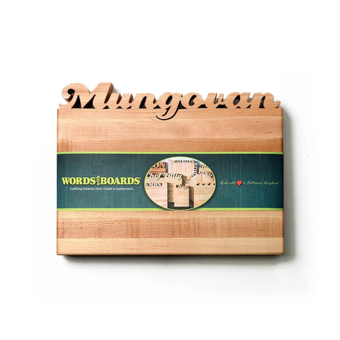 The Handcrafted Wooden Personalized Cutting Board (Small) by Words with Boards features Mungovan engraved on top and a green label. Made in the USA, its a practical kitchen accessory and a thoughtful personalized gift.