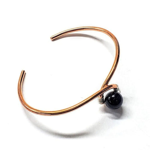 The Alexa Martha Designs Handmade Copper Silver Ribbon Child Abuse Awareness Teardrop Bangle is shown on a white background.