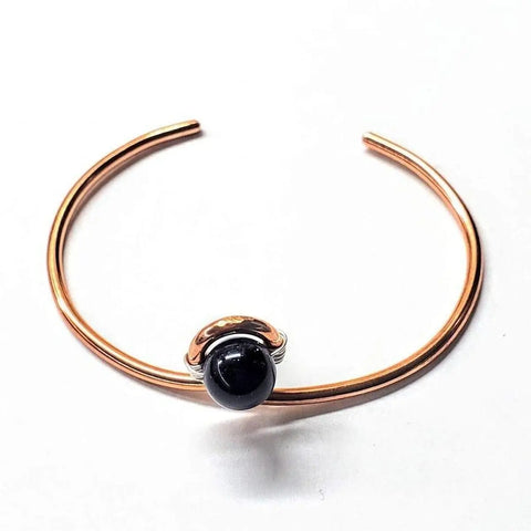 The Alexa Martha Designs Handmade Copper Silver Ribbon Child Abuse Awareness Teardrop Bangle features a unique handcrafted design, displayed on a plain white background.