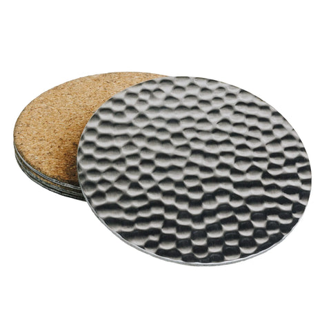 The Havens Luxury Metals Drink Coasters - Stainless Steel set features a top coaster with a textured, hammered stainless steel surface, while the rest are made from durable cork.