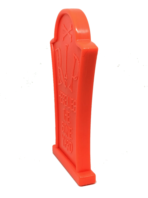 The SodaPup Headstone Ultra Durable Nylon Dog Chew Toy is a bright orange tombstone-shaped toy embossed with RIP, Here Lies The Bone Yard, and a skull and crossbones—perfect for aggressive chewers.