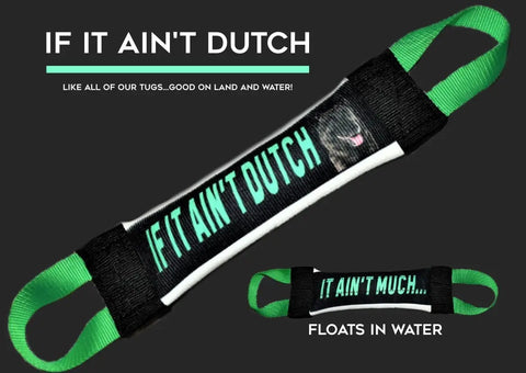 The If It Aint Dutch It Aint Much Fire Hose Training Tug by Bulletproof Pet Products Inc is a black and green heavy-duty dog toy with bold slogans on each side, crafted from fire hose material and shown against a dark background.
