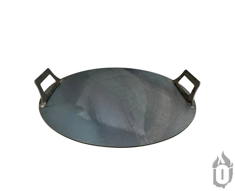 The Ohio Flame Heavy Duty Flat Fire Pit Lid is a round, flat griddle made in the USA from 3/16 American steel, featuring two rectangular handles and a natural metal finish—ideal as a durable fire pit accessory.