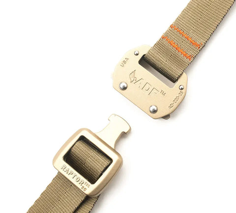 The MIS Tactical Belt in Coyote Tan features a durable nylon webbing strap and gold RAPTOR quick-release buckle, with both separated ends shown ready to be fastened.