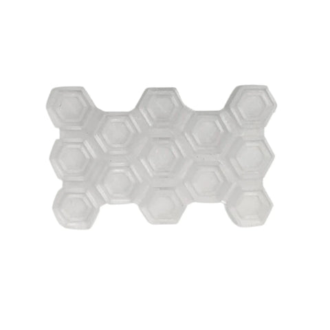 The Chatelet Manufacturing Snowboard Stomp Pad features a translucent silicone hexagon pattern with three connected rows, designed for better grip and weatherproof adhesion to snowboards, shown here against a white background.