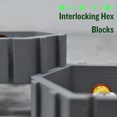 Close-up of gray interlocking hex blocks with Lego figures inside. Green text: “Hexagon Wall Display Compatible With Lego Figures by Chatelet Manufacturing—a unique wall display to customize and show off your collection. Made in USA.”.