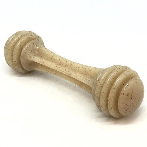 The SodaPup Honey Bone EChew Ultra Durable Nylon Dog Chew Toy, in light beige with rounded ends and slight speckling, is bone-shaped and ideal for power chewers. It’s shown lying on a white surface.