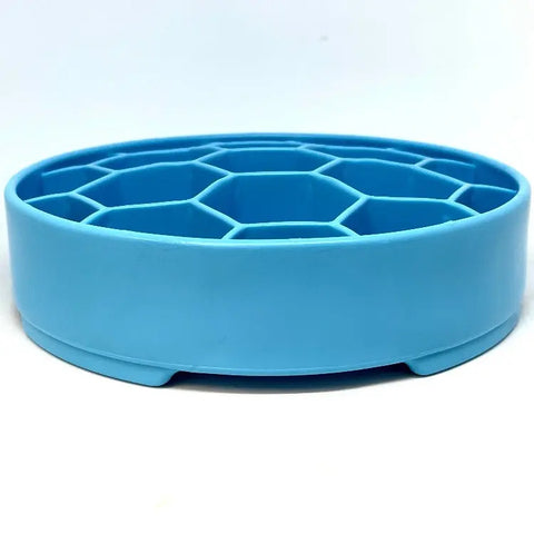 The SodaPup Honeycomb Design EBowl Enrichment Slow Feeder Bowl for Dogs is a blue, round plastic bowl with a honeycomb-patterned grid and short legs, designed to promote slow feeding, shown against a white background.