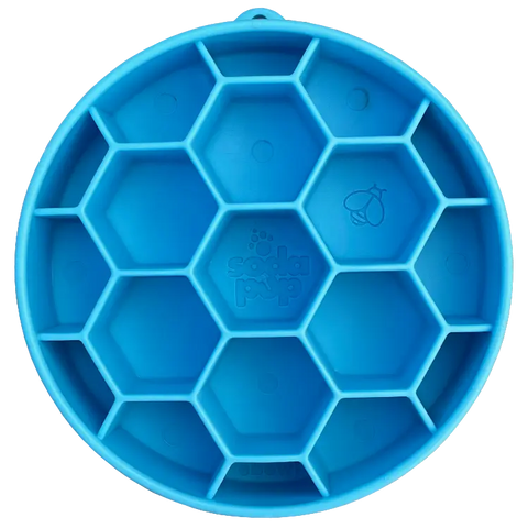The SodaPup Honeycomb Design EBowl Enrichment Slow Feeder Bowl for Dogs is a round blue silicone mat with a raised honeycomb pattern, a bee detail, and “Soda Pup” embossed in the center to encourage slower eating.