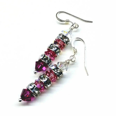 Alexa Martha Designs’ Hot Pink Ombre Stacked Crystal Sterling Silver Earrings feature pink, purple, and clear crystals with silver rhinestone spacers and silver hooks for a vibrant, elegant look.
