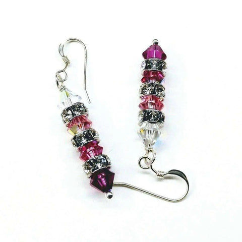 The Hot Pink Ombre Stacked Crystal Sterling Silver Earrings by Alexa Martha Designs feature Swarovski crystals in pink, purple, and clear hues, separated by silver spacers and finished with sterling silver hooks.