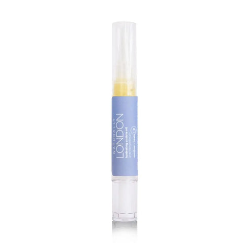 A clear tube of Naturally Londons Hydrating Cuticle Oil, 9mL, with a brush applicator and yellow oil, stands upright against a white background. The light blue label displays the brand name—ideal for nourishing nail care.