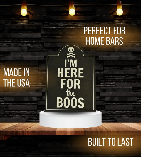 The “I’m Here for the Boos Halloween Bar Sign Decor” by Chatelet Manufacturing is a durable USA-made sign, perfect for home bars and Halloween parties. Display it with a dark wood backdrop and glowing lights for spooky festive décor.