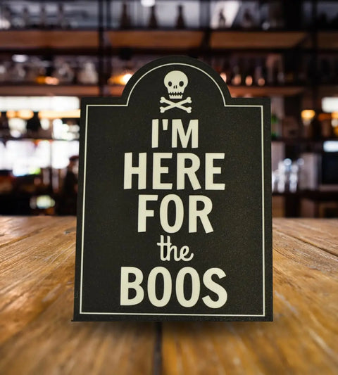 The Chatelet Manufacturing “Im Here for the Boos Halloween Bar Sign Decor” features a skull and crossbones and bold white text—an ideal spooky Halloween party decoration, made in the USA.