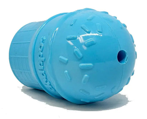The SodaPup Ice Cream Cone Durable PUP-X Rubber EDispenser Chew Toy is a light blue, cone-shaped treat dispenser for dogs with textured sprinkles and a small hole for adding treats.