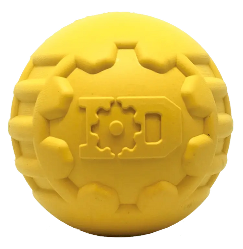 The SodaPup ID Ball Durable Rubber Chew Ball is a yellow natural rubber toy with raised, gear-like dental ridges and embossed L and D letters on its surface, designed for power chewers.